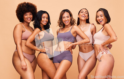 Image of Underwear, diversity and portrait of women in studio for wellness, beauty and self love campaign. Body positive, natural and happy people on brown background for confidence, skincare and inclusion
