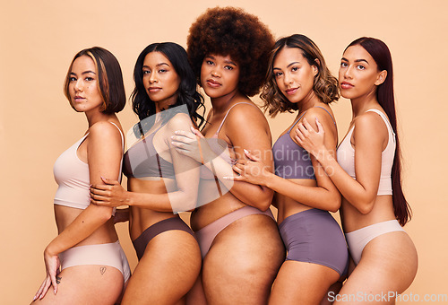 Image of Underwear, diversity and portrait of women in studio for wellness, beauty and self love campaign. Body positive, natural and people on brown background for confidence, skincare and lingerie inclusion