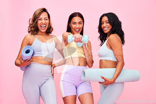 Image of Portrait, group and women with fitness, smile and pilates training on a pink studio background. Funny, girls and friends with exercise, self care and health with wellness, meditation and yoga mat