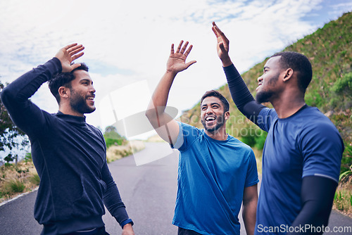 Image of Happy, men and friends high five for fitness, workout and running outdoor with a smile. Exercise, training and sports with motivation and success together on a road with wellness and excited support