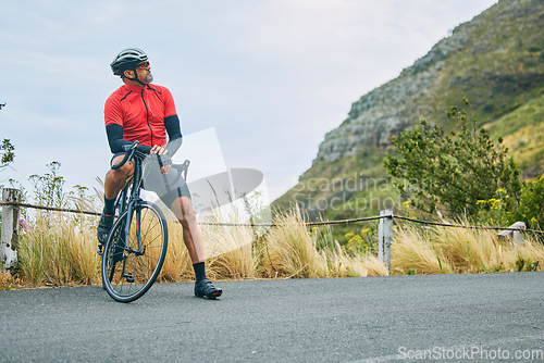 Image of Fitness, cycling and relax with man on bike in nature for sports, training and challenge. Exercise, workout and health with mature person on bicycle in mountains for energy, freedom and performance