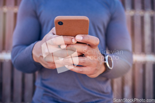 Image of Communication, phone and closeup of hands typing a text message on social media or mobile app. Technology, online and man scroll or chatting on the internet for blog or website with a cellphone.