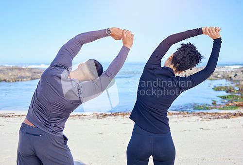 Image of Beach, exercise and back of stretching people, partner or couple of friends for fitness, teamwork and start workout. Tropical island, freedom and team wellness, muscle flexibility or sports warm up