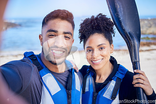 Image of Selfie, kayak and couple with a smile, beach and summer vacation with memory, post and social media. Portrait, people and man with woman, water sports and picture with ocean, training and holiday
