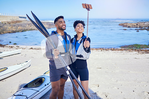 Image of Couple, selfie and outdoor for kayak or travel at a beach with stick for vacation memory. A man and woman with a profile picture for social media, influencer post and canoe or water sports in nature