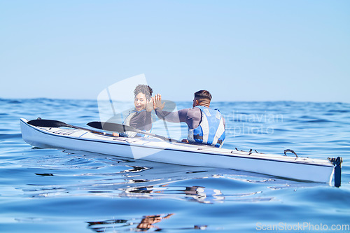 Image of Water, man and woman in kayak with high five on lake, beach or river in sports challenge on vacation. Ocean holiday, adventure and fitness, happy couple in canoe for training success and winning race