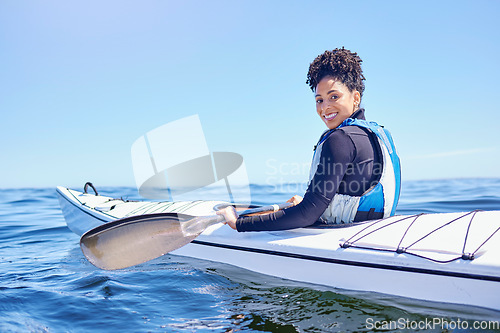 Image of Water, sports and portrait woman in kayak at lake, beach or river for exercise, race or challenge. Ocean holiday, adventure and fitness, happy girl in canoe for training workout or fun competition.