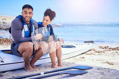 Image of Couple, portrait and outdoor for kayak or travel at a beach with a partner for teamwork. A happy man and woman with a canoe for sports, water adventure and vacation or freedom with space in nature