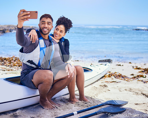 Image of Selfie, kayak and a couple on the beach to travel together for freedom, summer vacation or holiday. Relax, love or happy with a sports man and woman on a boat by the ocean or sea for adventure