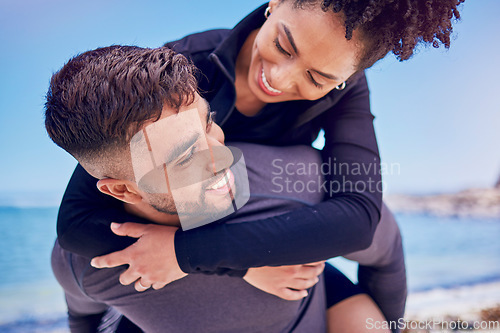 Image of Piggyback, love and fitness couple at a beach for training, bond and morning workout in nature. Sports, workout and happy man with woman at the ocean for wellness, freedom and exercise celebration
