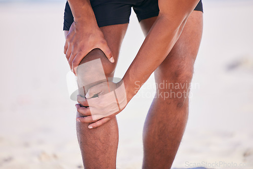 Image of Hands, knee pain and athlete at beach, accident and fitness exercise in sport workout outdoor. Legs, injury and arthritis of man, muscle problem and fibromyalgia in medical emergency for osteoporosis