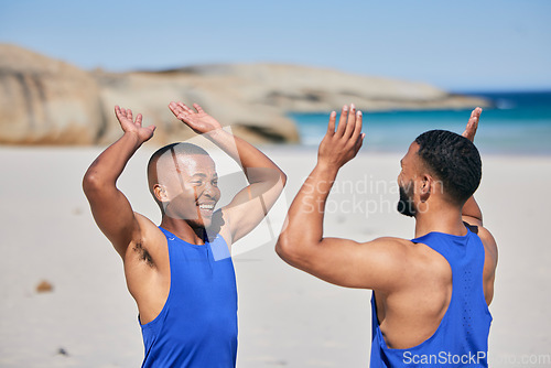 Image of Happy man, friends and high five in fitness on beach for workout success, training or outdoor exercise. Excited male person smile in happiness, teamwork or sports motivation together on ocean coast