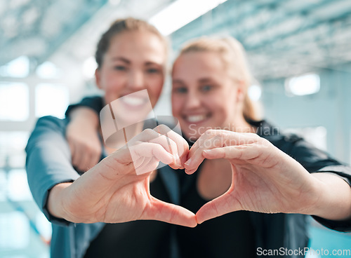 Image of Happy woman, swimming and heart hands in care, support or teamwork in sport fitness together at pool. Female person or professional swimmer with loving emoji, shape or symbol in team exercise or goal