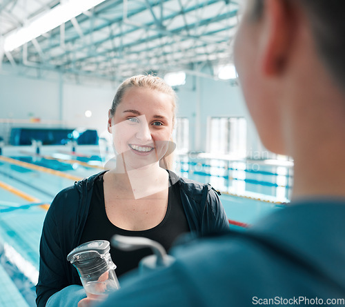 Image of Happy woman, friends and talking in swimming fitness, exercise or training together in sport at indoor pool. Female person or professional swimmer in happiness for discussion, competition or teamwork