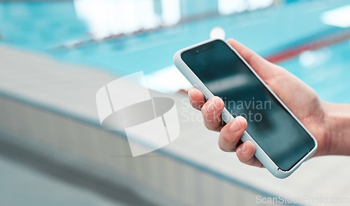 Image of Person, hand and phone mockup by pool in social media, communication or networking in sports fitness. Closeup of swimmer on mobile smartphone display or screen for swimming app or online search