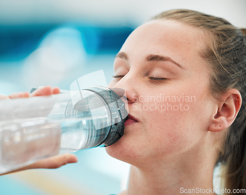 Image of Swimmer woman, drinking water bottle or thinking for fitness, health or wellness for sport career. Athlete girl, hydration and vision by swimming pool at training, exercise or workout for performance