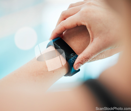 Image of Smartwatch, person or hands of swimmer at swimming pool for sports, workout or fitness progress. Personal trainer, exercise or closeup of athlete with timer to check or monitor heartbeat on app clock