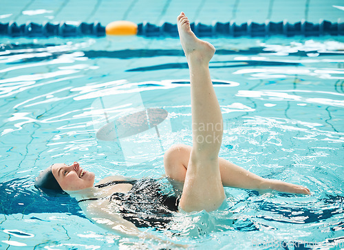 Image of Swimming, woman and legs in ballet exercise, training and healthy body wellness in water. Pool, feet and happy athlete in synchronized workout, sport art or dance performance for fitness in summer.