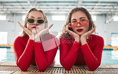 Image of Women, sunglasses portrait and fashion at a pool with gen z, hipster and style of girl friends with clothes. Red swimsuit, cool and trendy urban glasses with young people together in water and gym