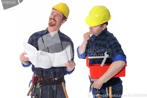 Image of Two construction workers with architectural plans 