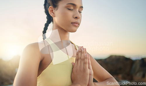 Image of Yoga, hands or woman in meditation at sunrise in nature for calm relaxing peace, wellness or mindfulness. Chakra, gratitude or healthy spiritual girl in zen lotus pose breathing to meditate or focus