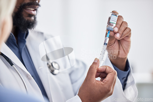 Image of Doctor, hands and bottle for vaccine in lab to stop virus bacteria and cure for covid for healthcare. Doctors, teamwork and research for covid 19 in laboratory with syringe, pharma or liquid drugs