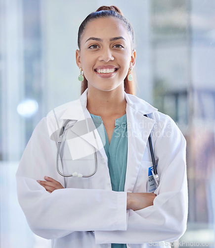 Image of Doctor, woman and portrait with healthcare and happy medical professional in hospital against blurred background. Health, career and female in medicine with success and smile for cardio health care