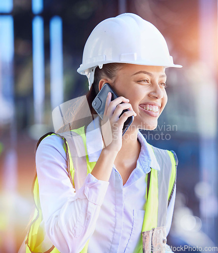 Image of Construction worker, woman with smartphone for phone call and communication with technology and helmet for safety. Happy with construction, building industry and mobile phone, contact with lens flare