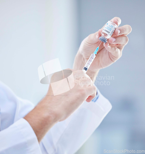 Image of Hands, covid and doctor with vaccine syringe for healthcare, wellness and virus immunity. Corona, injection and medical professional holding needle for vaccination and covid 19 prevention in hospital