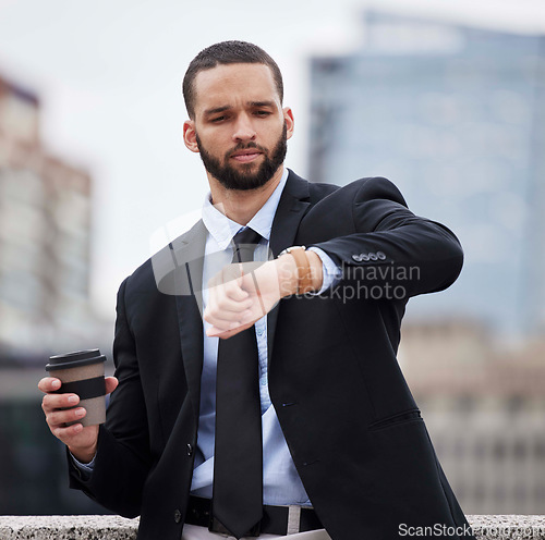 Image of Businessman, watch and check time in city for schedule, business meeting or street by buildings. Corporate black man, clock and late for finance meeting in metro, frustrated and coffee in cityscape