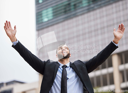 Image of Businessman celebration, city and winning with smile, success or suit in financial advisor job. Corporate man, hands and air goals, vision or motivation by metro buildings with happiness in New York