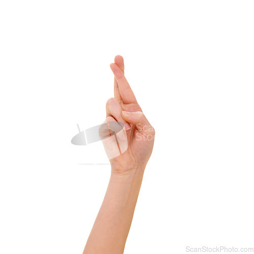 Image of Fingers crossed, hand and sign language gesture isolated against a studio white background. Luck, hope and wishing closeup with copy space showing optimism, superstition and positivity