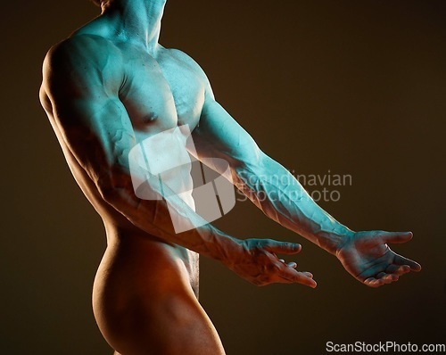 Image of Body, art and muscle with a nude man in studio on a dark background for artistic expression or freedom. Creative, sexy and model with a naked male posing to promote artwork, sensuality or fitness