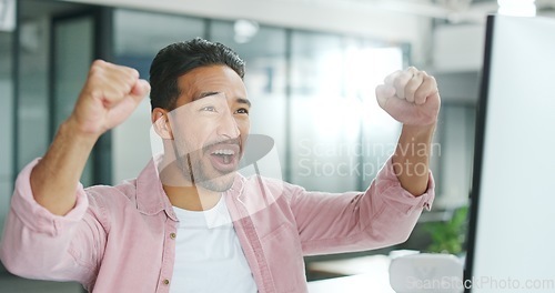 Image of Winner, motivation and celebration with a business man reaching a goal or target in his office at work. Wow, goals and success with a male employee celebrating a deal or promotion while working