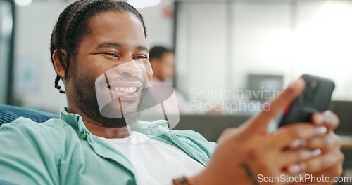 Image of Laugh, happy and mobile text of a black man typing on social media communication app. Laughing, internet scroll and web meme of a man online on a mobile phone texting and reading a funny joke