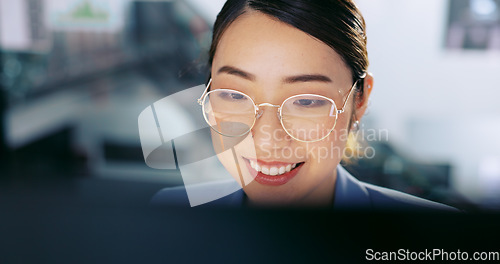 Image of Business woman, face and work at computer, typing report or proposal for overtime, smile and deadline with kpi target. Online, connect and happy Asian worker with professional success and corporate.