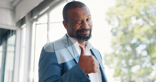 Image of Walking, wink and thumbs up with a business black man looking happy with a mindset of future growth. CEO, management and trust with a senior male employee making a hand sign or gesture at work