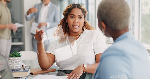 Image of Paperwork, discussion and business women in the office analyzing company review, proposal or report. Documents, professional and female corporate employees in conversation working on project together