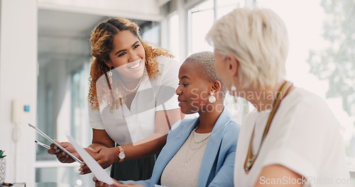 Image of Tablet, documents and teamwork of business women discussing sales, advertising or marketing data. Paperwork, tech and group of business people with touchscreen planning strategy in office workplace.