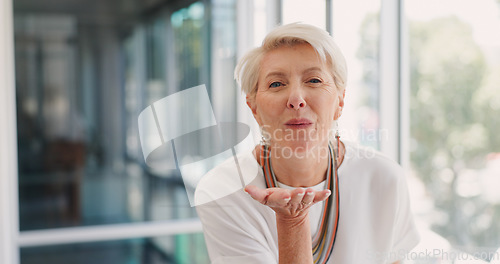 Image of Happy, blowing kiss and face of business woman in office for management, leadership or confident. Professional, executive and smile with portrait of ceo in startup agency for mindset, career or flirt