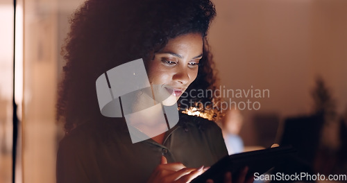 Image of Office, night and happy black woman on a phone at her job in the dark smiling about funny text. Business, technology and social media mobile app scroll of a person working late on a work break