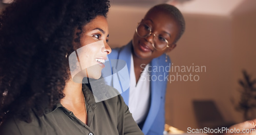 Image of Night business, employees laughing and computer planning, talking and discussion funny research, data and strategy ideas in dark modern office together. Two happy young women working late in startup