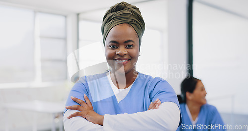 Image of Face, black woman arms crossed and doctor with smile, consultant and in hospital. Leader, African American female and medical professional with happiness, ready for surgery, procedure and healthcare.