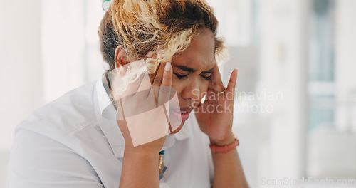 Image of Burnout, headache or depression black woman in office building with headache, deadline stress and mental health. Sad, frustrated or employee with financial, stock market crash or investment anxiety