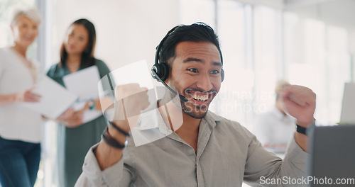 Image of Applause, success and man celebrate at call center for target, bonus and sale with employees for congratulations on win. Contact us, CRM and telemarketing customer support men and women at computer