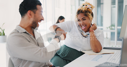 Image of Laptop, success or happy employees fist bump in celebration of sales goals or target at office desk. Support, mission or woman celebrates partnership growth, team work or achievement with worker