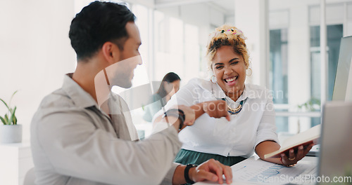 Image of Laptop, success or happy employees fist bump in celebration of sales goals or target at office desk. Support, mission or woman celebrates partnership growth, team work or achievement with worker