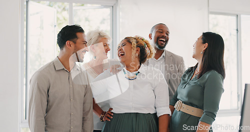 Image of Success, happy or funny business people in an office building laughing at a funny joke after a group meeting. Diversity, comic or employees with big smiles bonding after a successful business deal