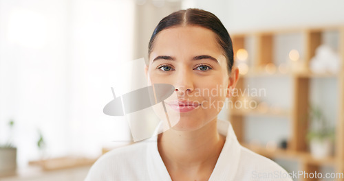 Image of Face, portrait and woman at spa for skincare, luxury massage and wellness on a bed at a hotel. Happy, smile and beauty of a young girl at a salon to relax for peace and calm during cosmetic therapy