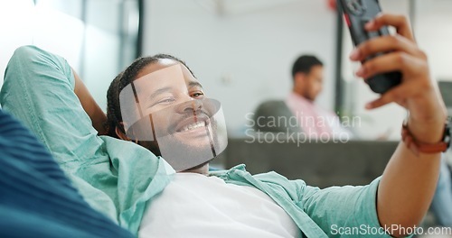 Image of Black man, phone and peace sign on video call with smile for social, networking or communication at the office. African American man relaxing on break talking on smartphone videocall at the workplace